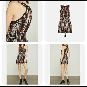 Bcbgmaxazria romper size large.  Brown design.  Comes with a belt.